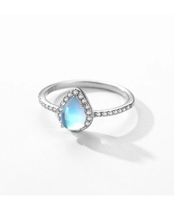 Macro shot of pear-shaped moonstone ring with sparkling pavé cubic zirconia details