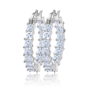 Macro detail of silver S925 hallmark and square princess cut zircon on hoop earrings