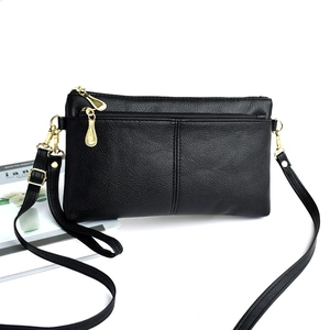 Elegant black lychee textured leather crossbody bag with adjustable gold hardware