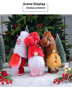 Detailed view of three Christmas gnomes with candy cane and gingerbread decorations