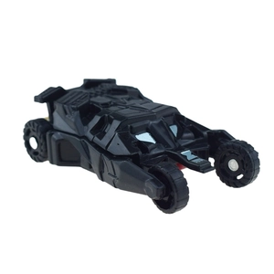 Detail view of a matte black armored tumbler vehicle toy with multi-wheel design