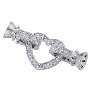Macro view of silver heart-shaped clasp with pave-set cubic zirconia for jewelry making