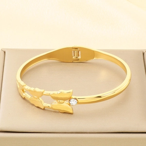 Detailed macro view of 18K gold plated butterfly bangle with sparkling zircon stone