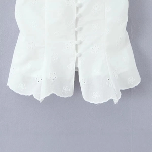 White lace embroidered top with floral cutouts and button detailing for women