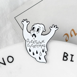Close-up of Ghost enamel pin with Overthink Everything text on white background