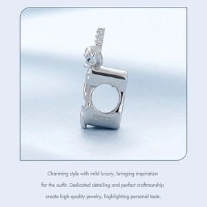 Close-up of S925 sterling silver guitar rose charm with detailed metal engraving