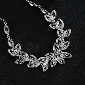 Macro shot of silver-tone bridal leaf bracelet with AAA cubic zirconia inlays