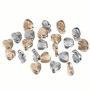 Textured heart-shaped spacer beads in gold and silver for DIY jewelry making