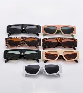 Detailed flat lay of rectangle wide frame sunglasses in seven assorted colors and textures