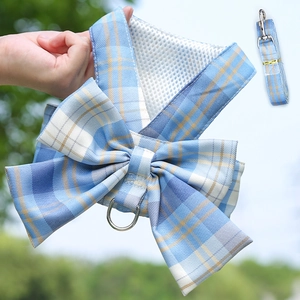 Close-up of blue and yellow plaid pet harness with large bow and breathable mesh