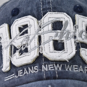 Navy blue washed cotton baseball cap with 1989 embroidery and distressed vintage finish