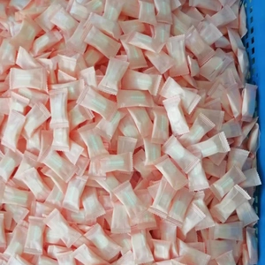 Bulk view of individually wrapped disposable compressed towels in a blue container
