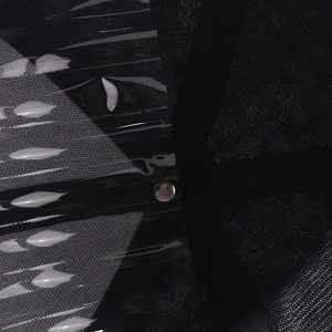 Detailed macro view of the glossy black synthetic leather and mesh fabric on a baseball cap