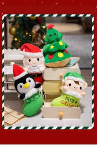 Plush Christmas dolls including Santa and tree set on a cabinet for festive home decor