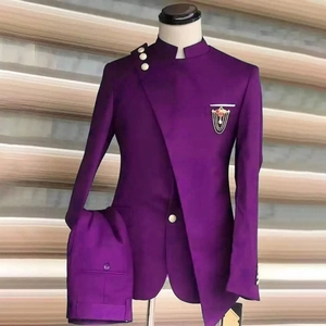 Detail of purple stand collar tuxedo with asymmetrical lapel and golden button accents