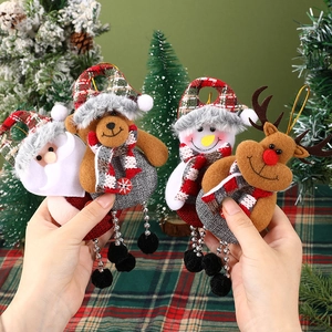 Set of 4 Christmas plush ornaments featuring Santa, Snowman, Bear and Reindeer on a tree