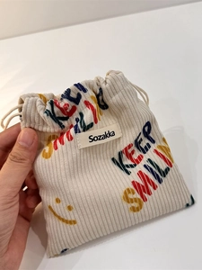 Corduroy drawstring storage bag with Keep Smiling print and smiling face pattern