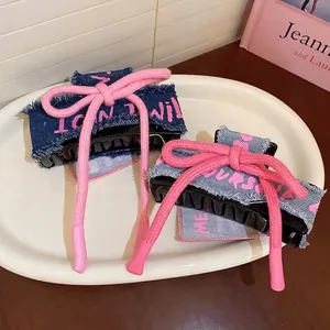 Denim fabric bow hair claw clip with pink woven rope and inspirational lettering