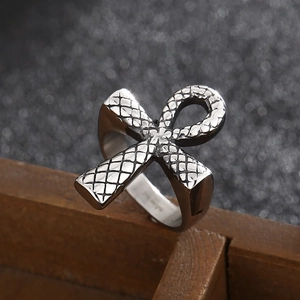 Detailed macro view of vintage Ankh ring with textured silver finish and snake pattern
