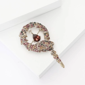Luxury silver snake brooch with multicolor rhinestones and a red teardrop gemstone