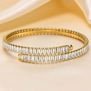 Gold stainless steel wrap bracelet with baguette-cut cubic zirconia and sphere ends