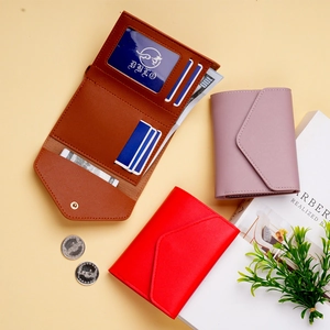 Detailed interior of minimalist faux leather wallet showing multi-card slots and ID window