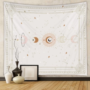 Detail of sun and moon phases tapestry with constellations on a minimalist gray wall