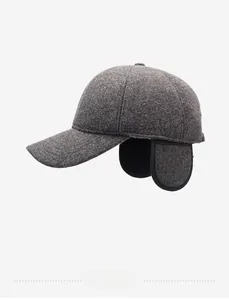 Detail view of winter ear-flap baseball cap in grey wool blend with metal logo