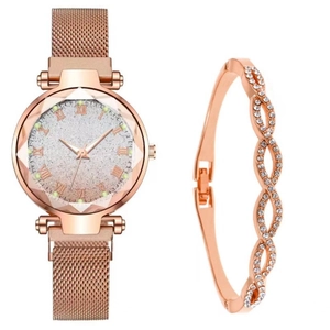 Detail of rose gold starry dial watch set with Roman numerals and matching crystal bracelet