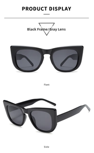 Detailed front and side views of oversized black cat-eye sunglasses with dark lenses