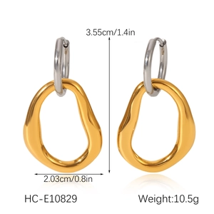 Detail showing two-tone geometric drop earrings with dimensions 3.55cm by 2.03cm and weight
