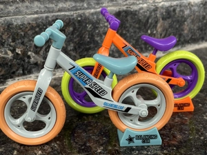 Detailed macro view of colorful toy balancing car models with Super Speed printing