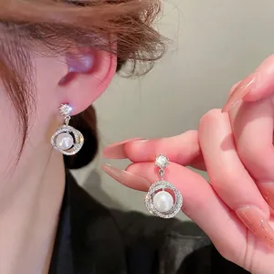 Elegant S925 silver pearl drop earrings with star studs and sparkling zircon circles