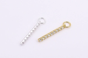 Macro detail of S925 sterling silver rectangular pendants with micro-set cubic zirconia