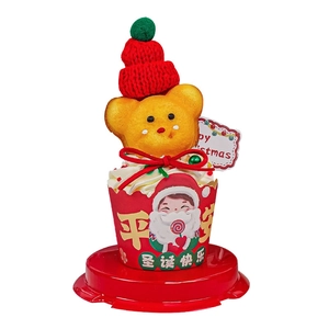 Mini Christmas cupcake box with yellow bear topper and festive red Santa Claus wrappers