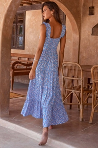 Detail of the ruffle straps and smocked back on a blue floral bohemian maxi dress