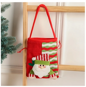 Hanging knitted Christmas gift bag with 3D Santa Claus doll on a rustic wooden ladder