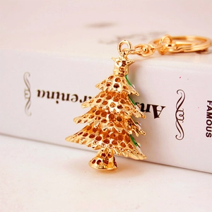 Golden rhinestone Christmas tree keychain with colorful crystals and hollow metal design
