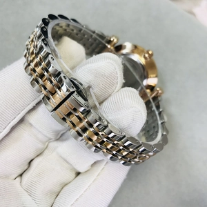 GEDI minimalist steel watch for women featuring bicolor gold and silver link bracelet