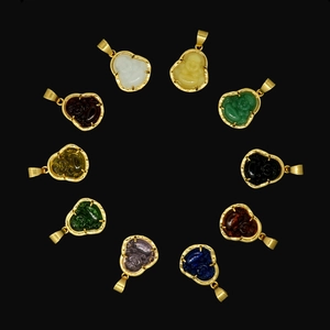 Detailed view of ten 18k gold stainless steel Buddha pendants in assorted colorful glass stones