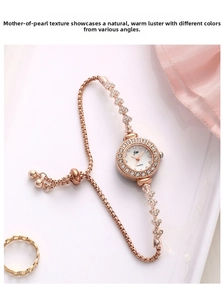 Macro shot of rose gold jewelry watch featuring a diamond bezel and mother of pearl dial
