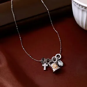 Vintage adjustable silver bead necklace with cross pendant and zircon charms on velvet