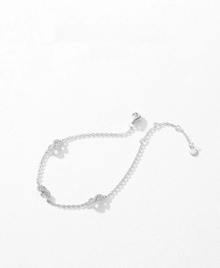 Macro shot of S925 sterling silver infinity bracelet with pavé cubic zirconia details