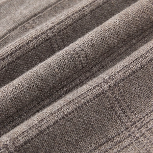 Detailed close-up showing the soft brownish-grey knit fabric texture and ribbed pattern