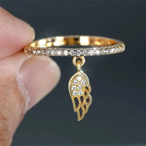 Golden wing ring with sparkling zircon stones and feather pendant for women