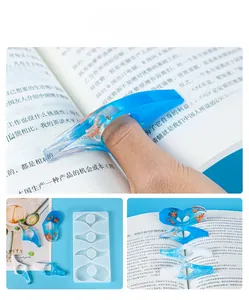 DIY silicone mold for resin thumb page holder showing detailed book reading accessories