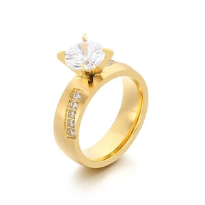 Elegant gold stainless steel four-prong diamond ring with brushed finish and accents