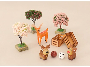Miniature Christmas set with reindeer, basketball, soccer ball and flowering trees