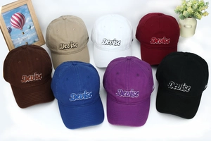Detail of multi-color cotton baseball caps with Devise embroidery and curved brims
