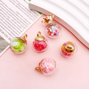 Detail of colorful fruit and star sequin glass bottle pendants for DIY jewelry making